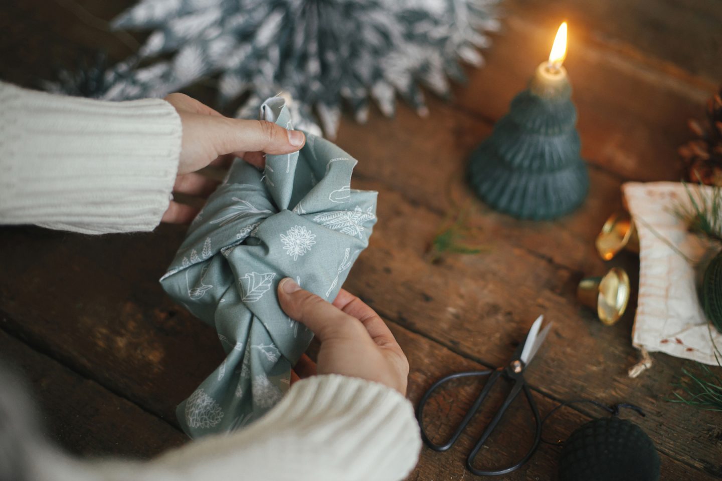 Woman wrapping a Christmas gift