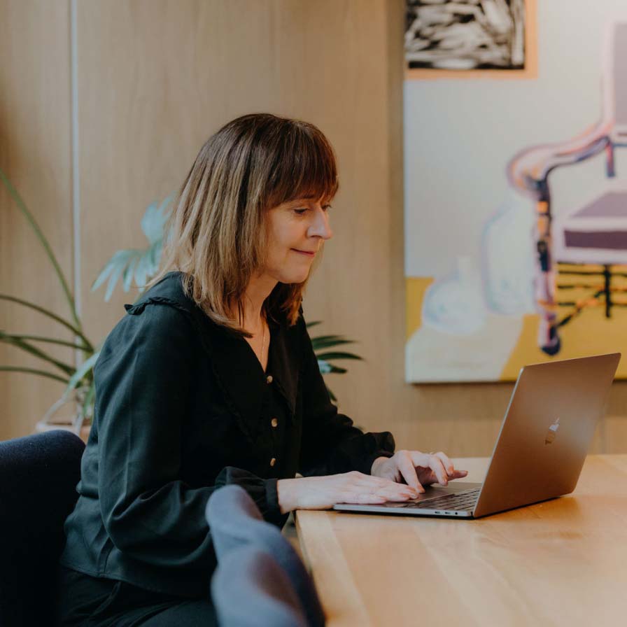 Debbie at a desk