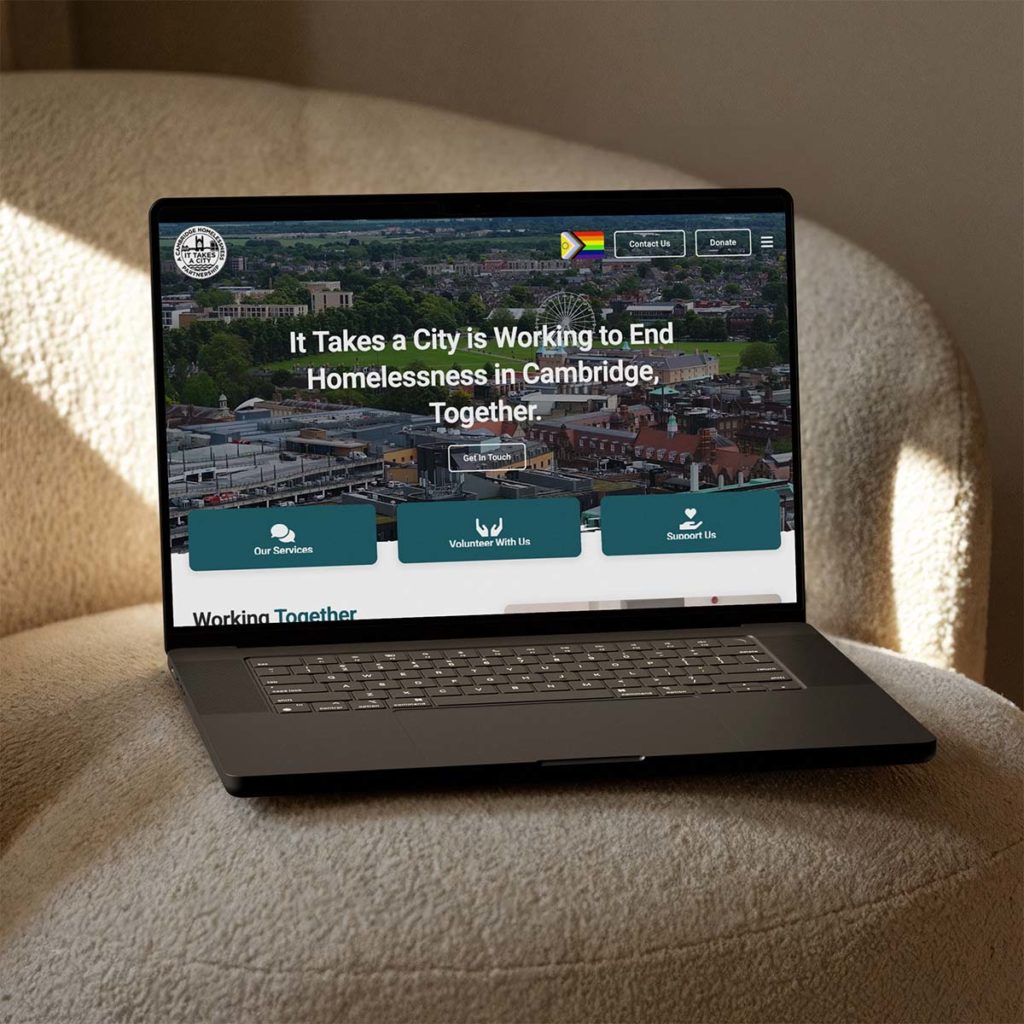 It Takes A City website on a laptop